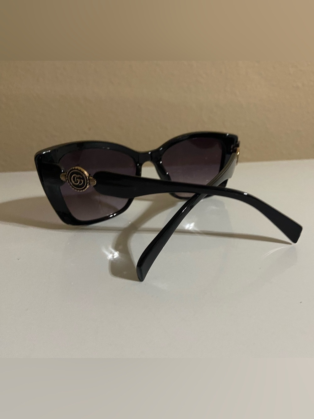 Gucci Black Sunglasses with Gold GG Medallion